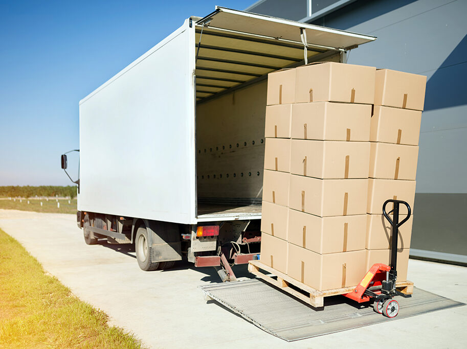 Truck transporting goods packed in boxes from warehouse