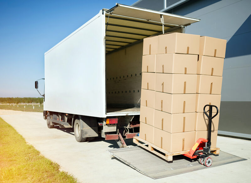Truck transporting goods packed in boxes from warehouse